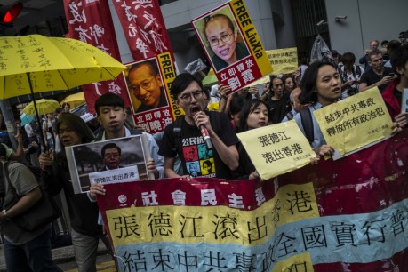 Rights advocate leaves house arrest in China for treatment in Germany