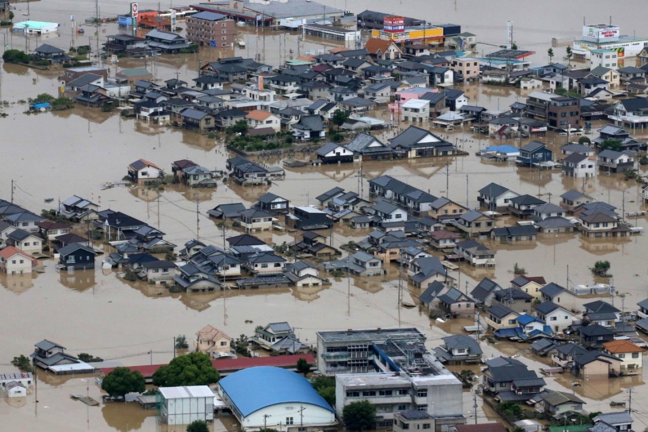 An aerial view of flooded houses in Kurashiki, Okayama prefecture on July 8, 2018