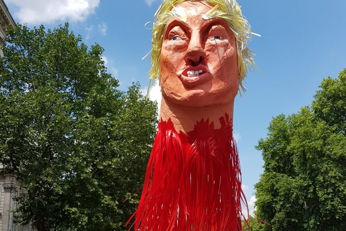 An effigy of Donald Trump's severed head rallies demonstrators in London.