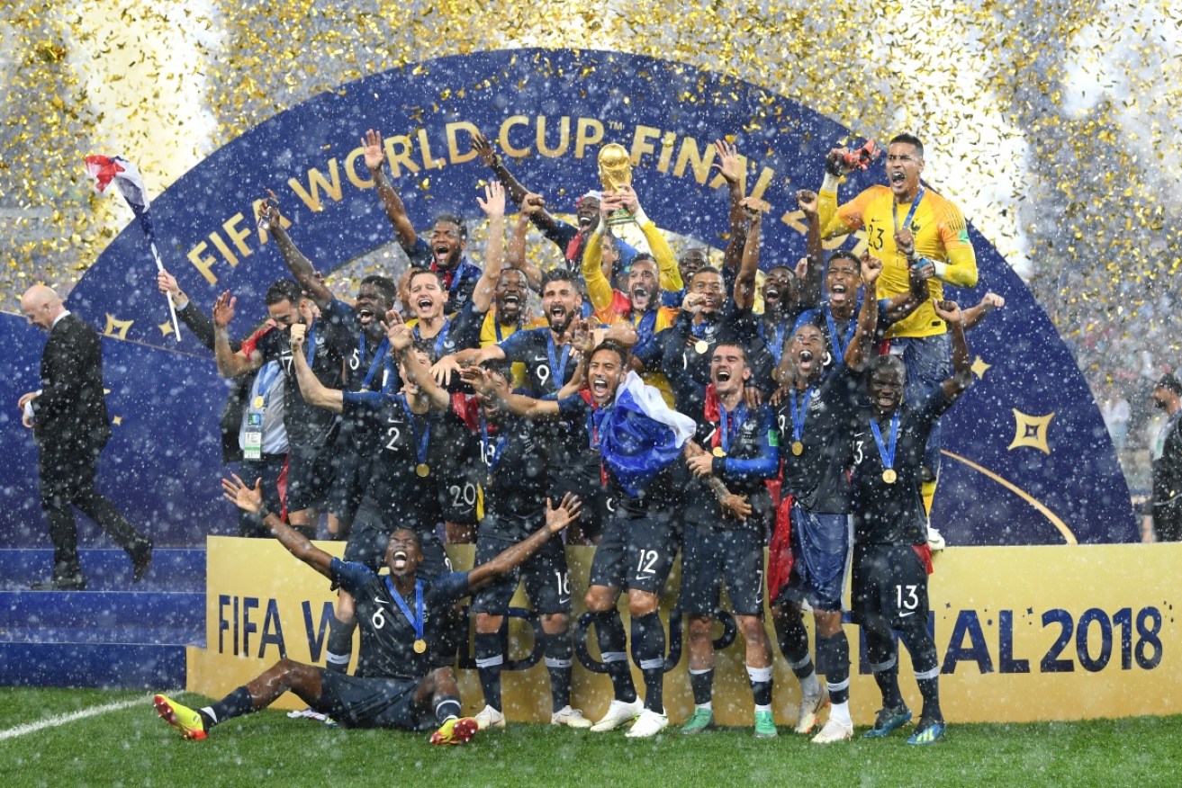 The look of joy: France players celebrate with the famous trophy.