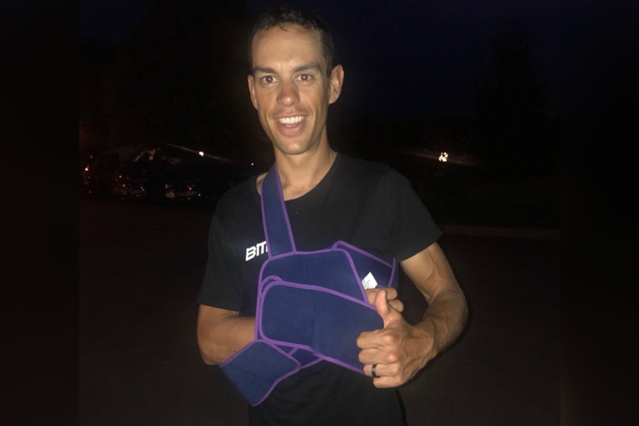 Upbeat: Porte leaves hospital after his Tour ended with a broken collarbone. 