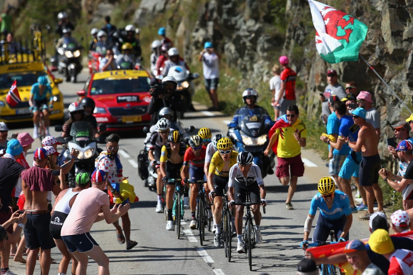 A fan at the Tour de France tried to push Chris Froome off his bicycle during the 12th stage.