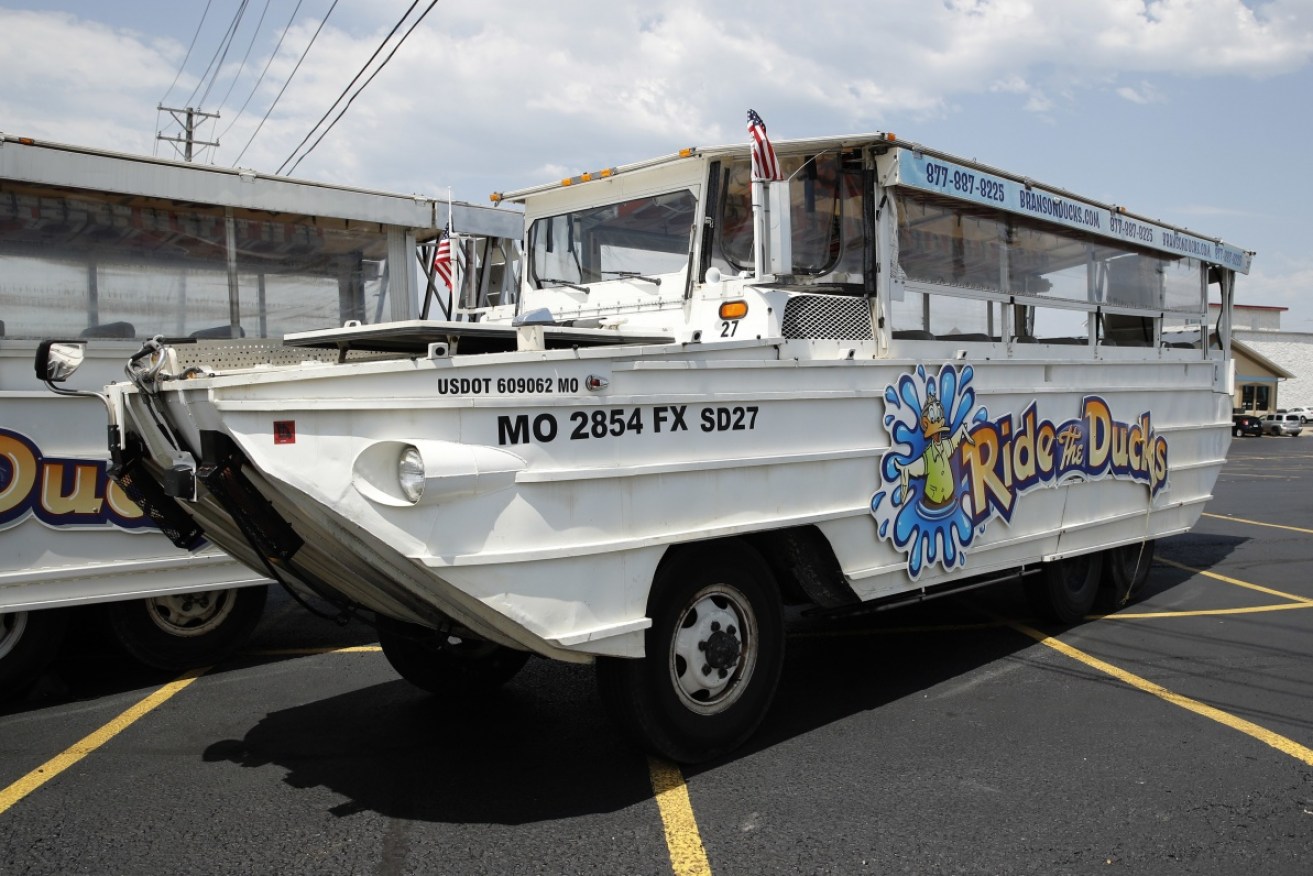 A duck boat sits idle in the parking lot of Ride the Ducks, an amphibious tour operator in Branson, A duck boat sits idle in the parking lot of Ride the Ducks, an amphibious tour operator in Branson, Missouri