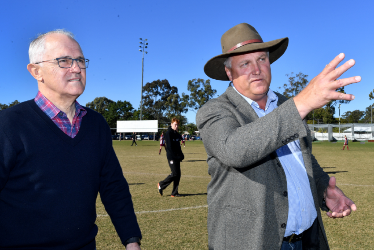 Prime Minister Malcolm Turnbull (left) joins the LNP candidate for Longman, Trevor Ruthenberg at the Caboolture Sports Football Club.