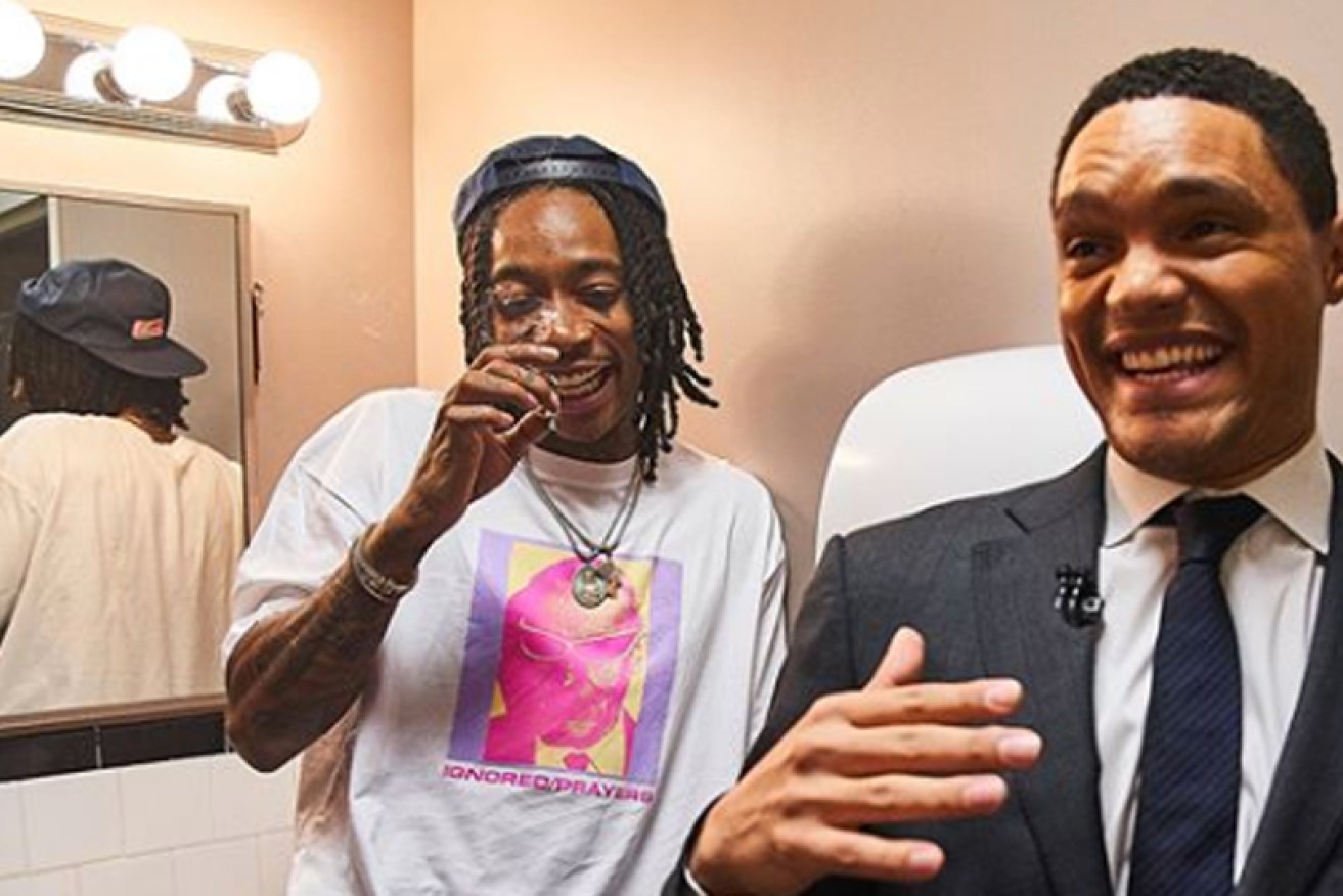 Trevor Noah in his TV show's green room with singer Wiz Khalifa on July 19. 