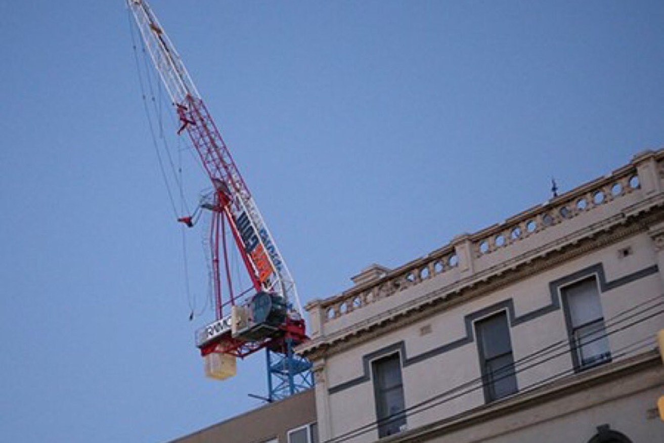 The crane was damaged as powerful winds lashed the state.