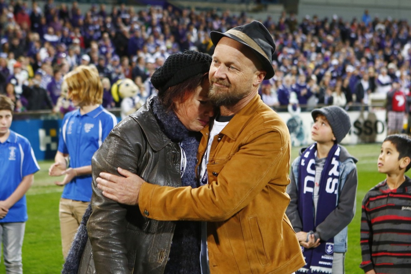 Rin Norris and Anthony Maslin at an AFL tribute to their three children in 2014.