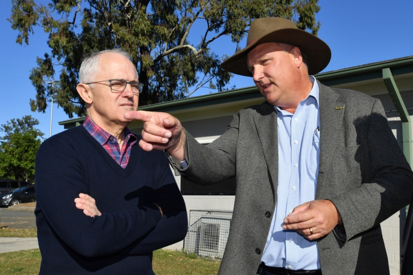 Prime Minister Malcolm Turnbull (left) and the LNP candidate for Longman, Trevor Ruthenberg at the Caboolture Sports Football Club on Saturday.