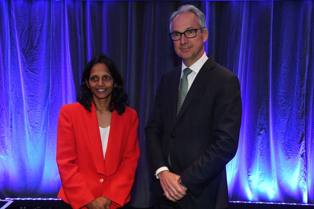 Macquarie Group's incoming CEO Shemara Wikramanayake is welcomed by outgoing CEO Nicholas Moore.