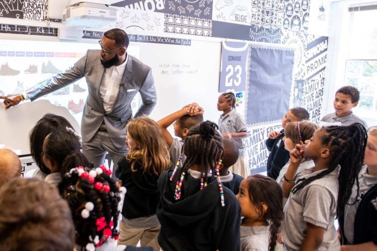 LeBron James celebrates the recent  opening of his Promise School in Akron, Ohio.

