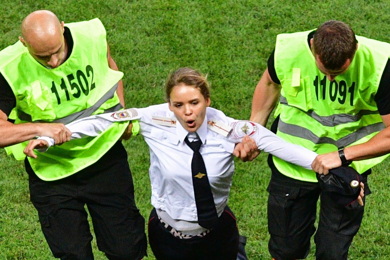 A  Pussy Riot protestors is removed from the World Cup final on July 15.