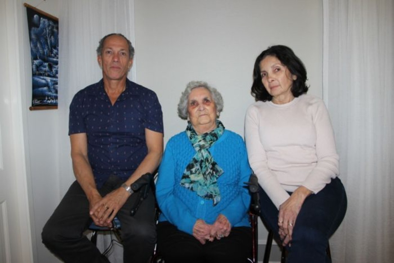 Big bill: Joan Ford (centre), her daughter Patricia Matthys and son-in-law Mark. 