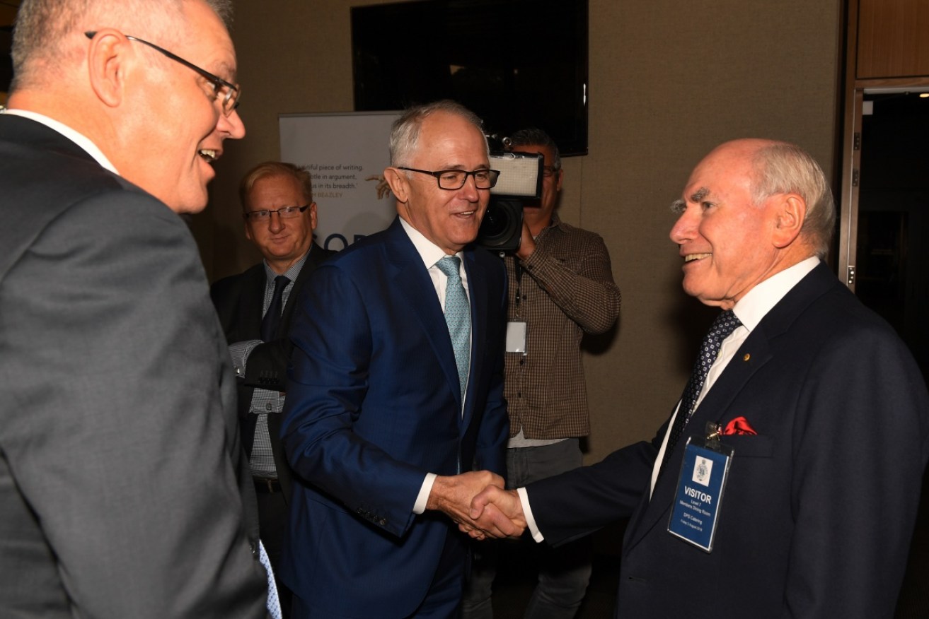Prime Minister Malcolm Turnbull with former prime minister John Howard and Treasurer Scott Morrison (left).