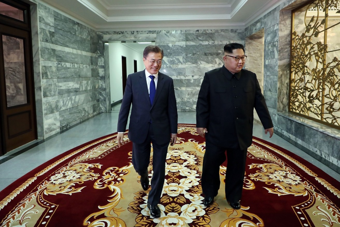 South Korean President Moon Jae-in walks with North Korean leader Kim Jong-un in May in Panmunjom.