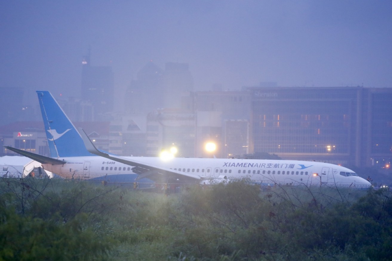 Heavy rain forced the B737 aircraft to skid off the runway while landing.