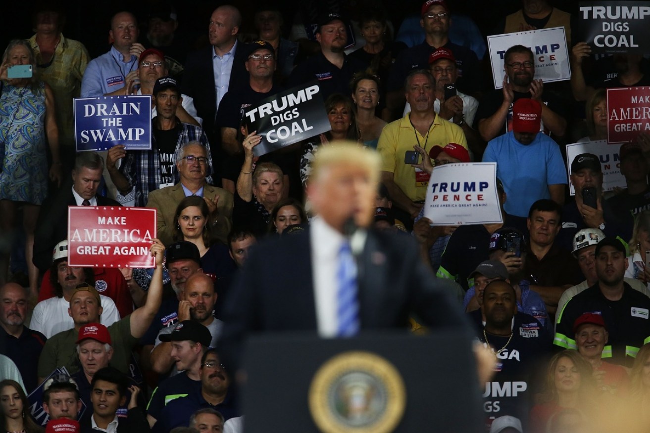Donald Trump among supporters in Virginia – where he made little mention of the convictions of two of his inner-circle.