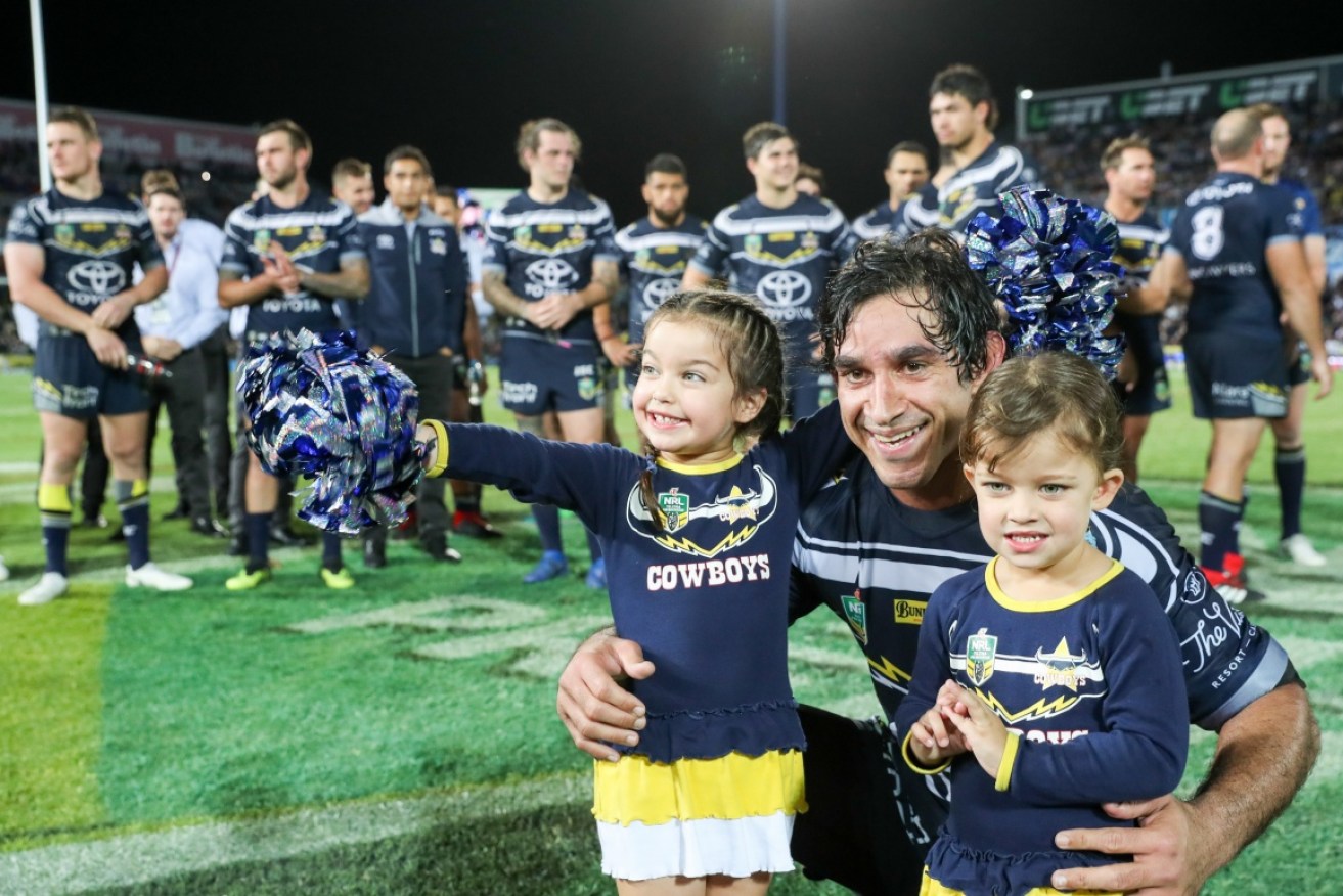 Johnathan Thurston co-captain of the Cowboys with his children Frankie (left) and Charlie (right) after his last home game.  