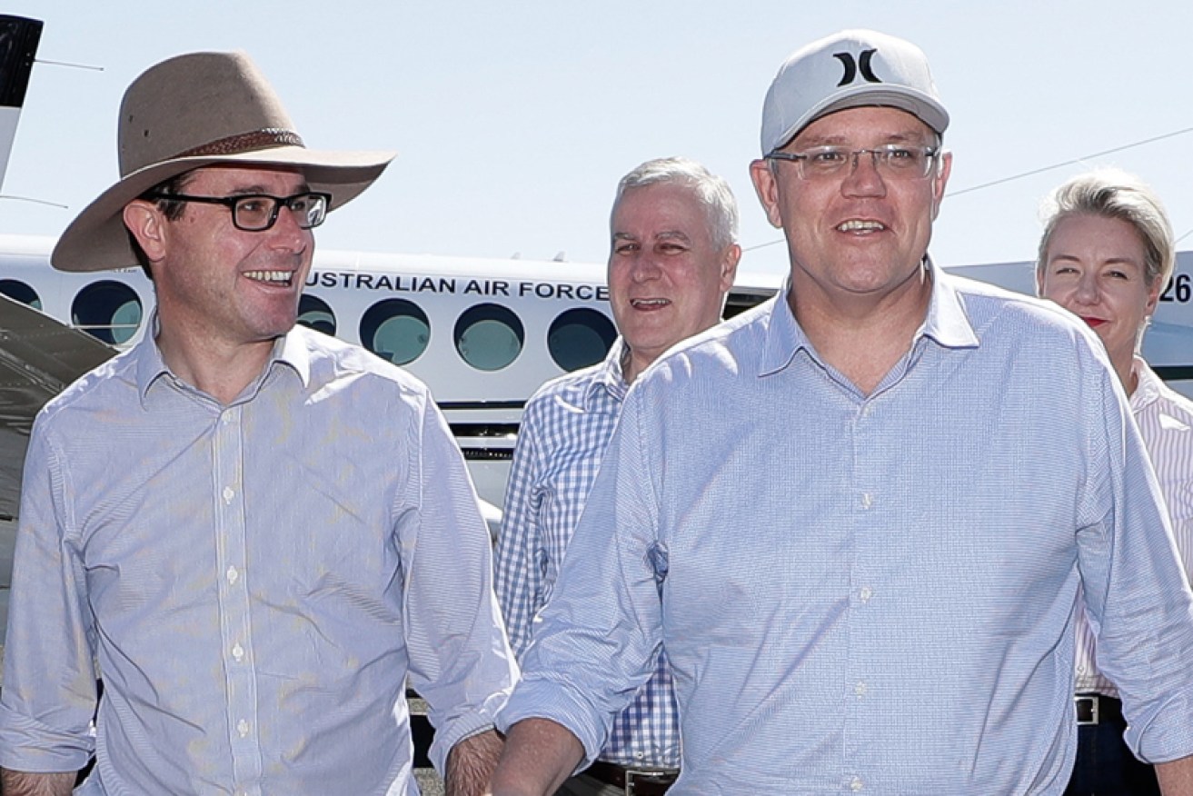 A baseball cap-wearing Prime Minister announces no new measures for drought-hit areas.