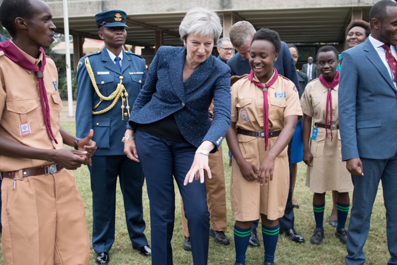Do try this at home: Mrs May shakes her groove thing in Nairobi, Kenya on August 30.