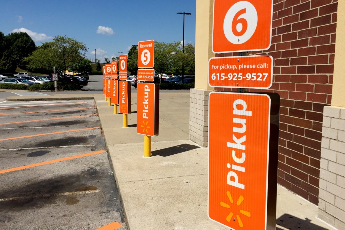 Walmart parking spaces designated for online grocery pickup so customers can get in and out quickly.