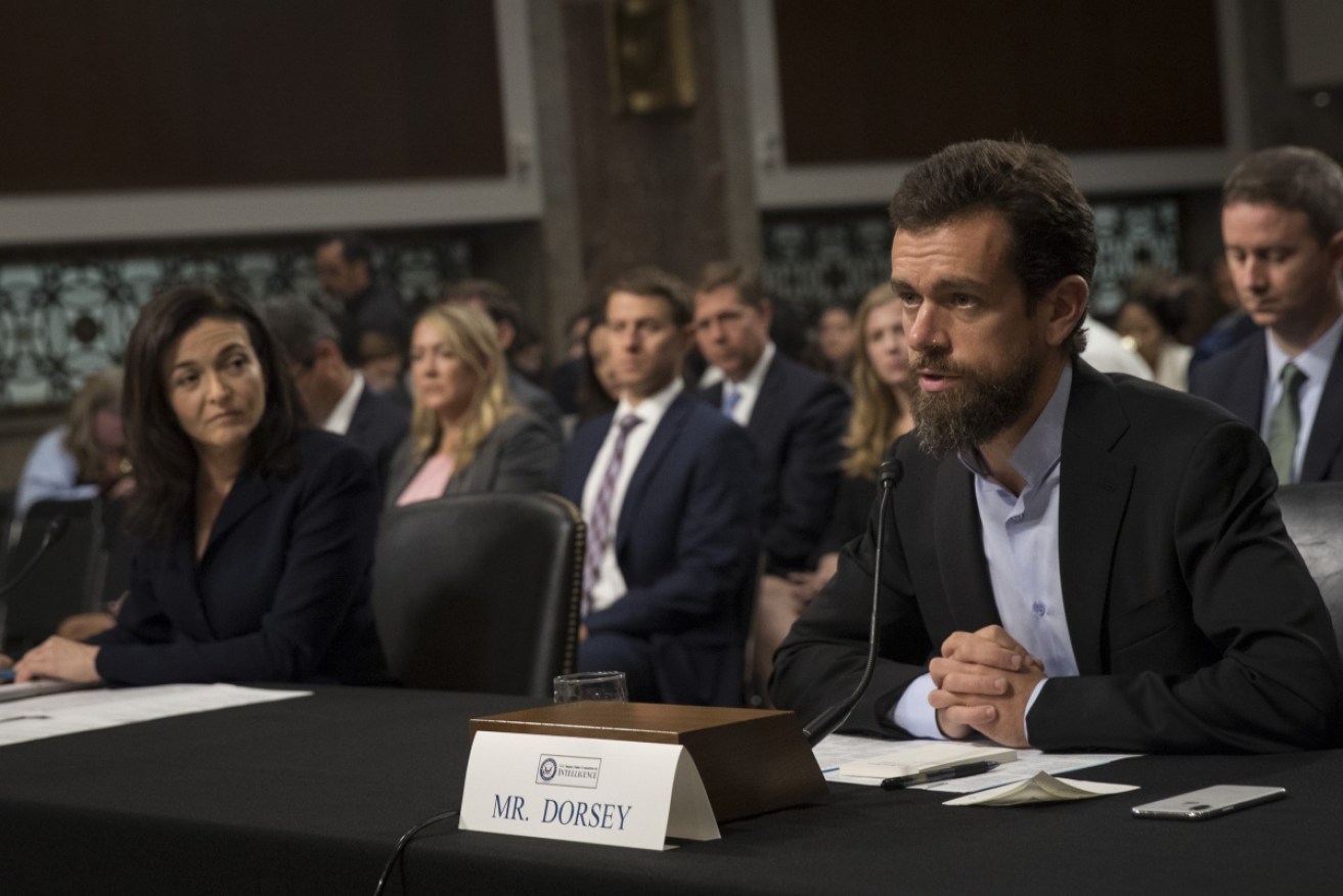 Facebook chief operating officer Sheryl Sandberg and Twitter chief executive officer Jack Dorsey testify during a Senate Intelligence Committee hearing.