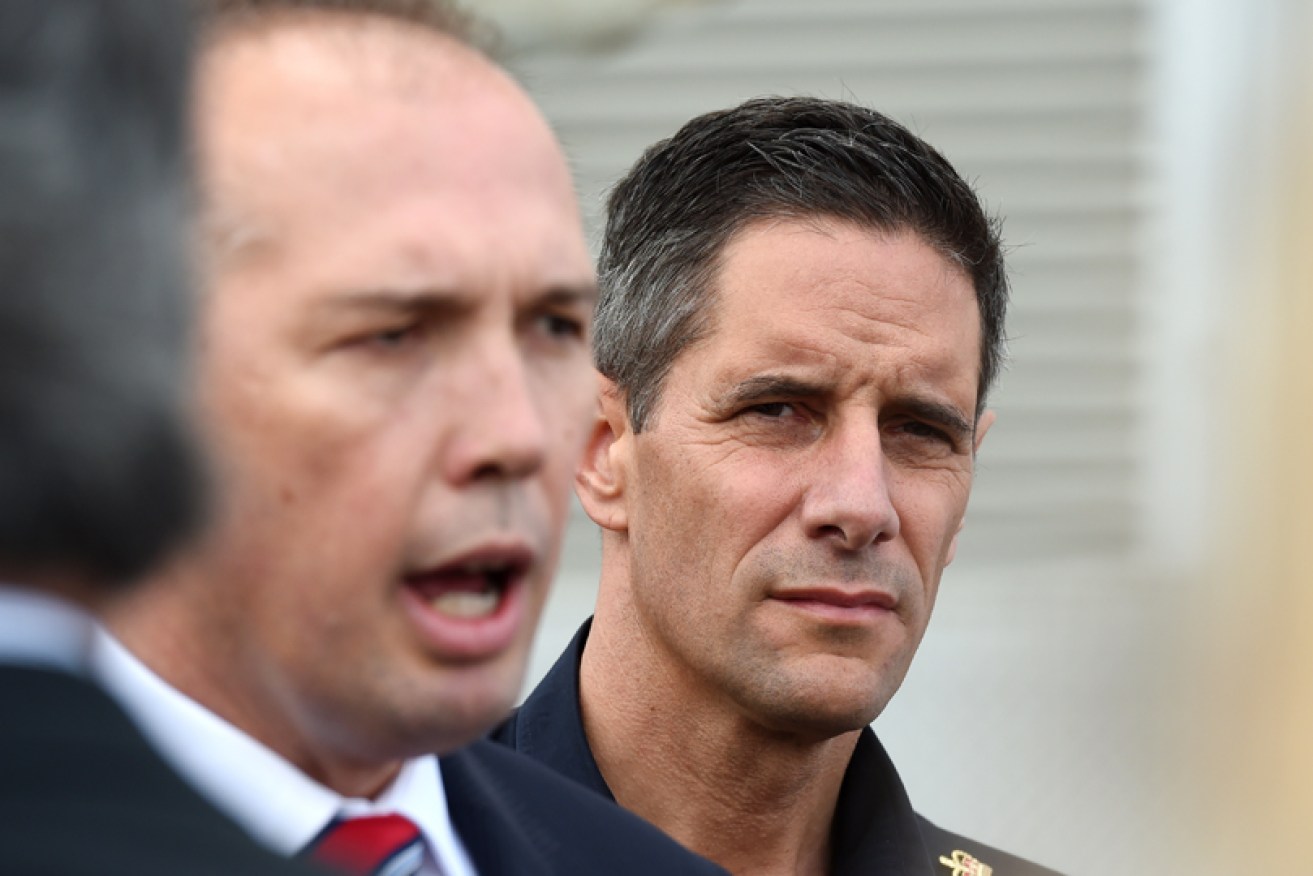 Peter Dutton and Roman Quaedvlieg at a media conference in 2015.