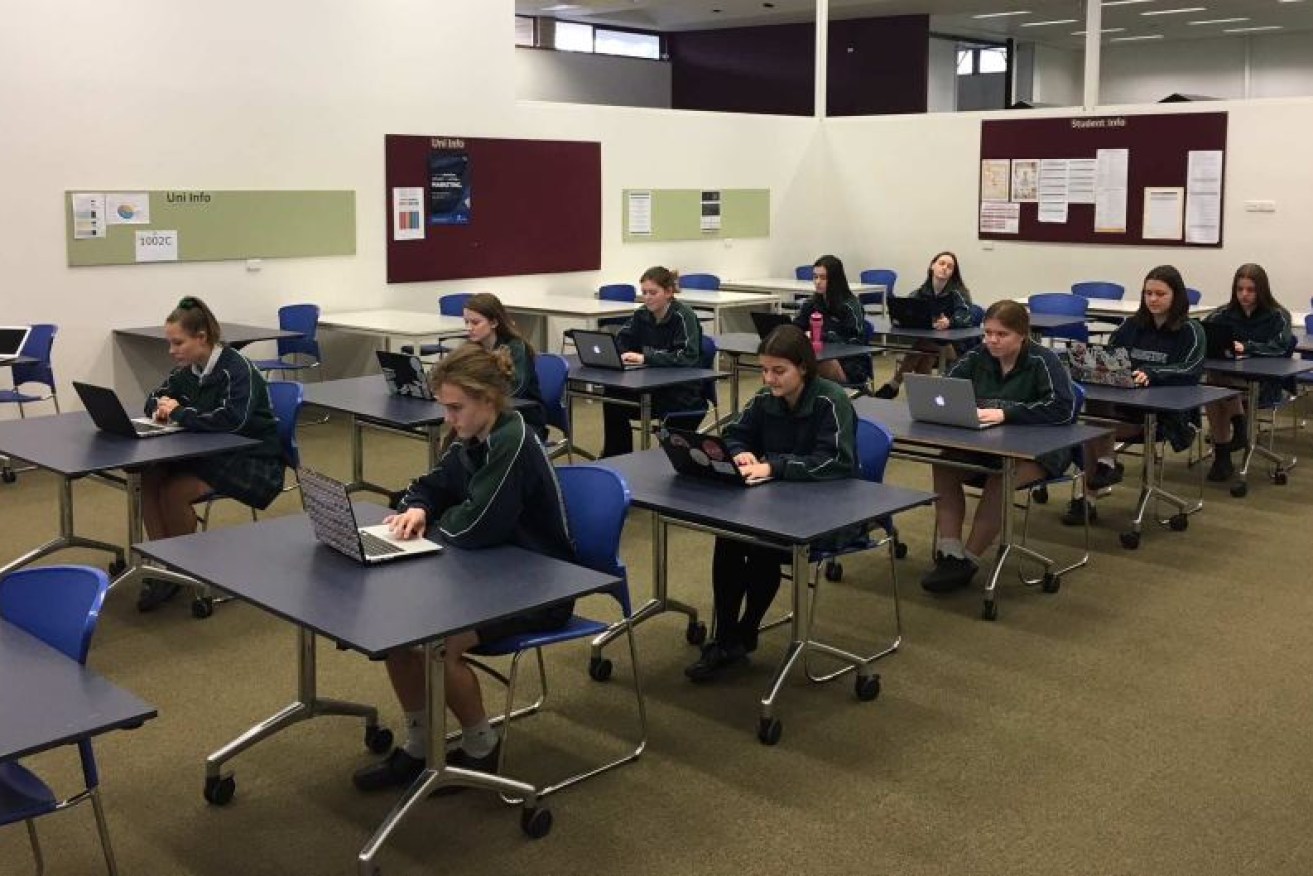 Year 12 students from Brighton Secondary School sit a trial electronic exam on Tuesday.
