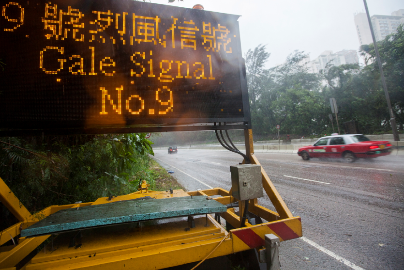 One of scores of signs across Hong Kong warning residents to batten down for Typhoon Mangkhut's big blow.