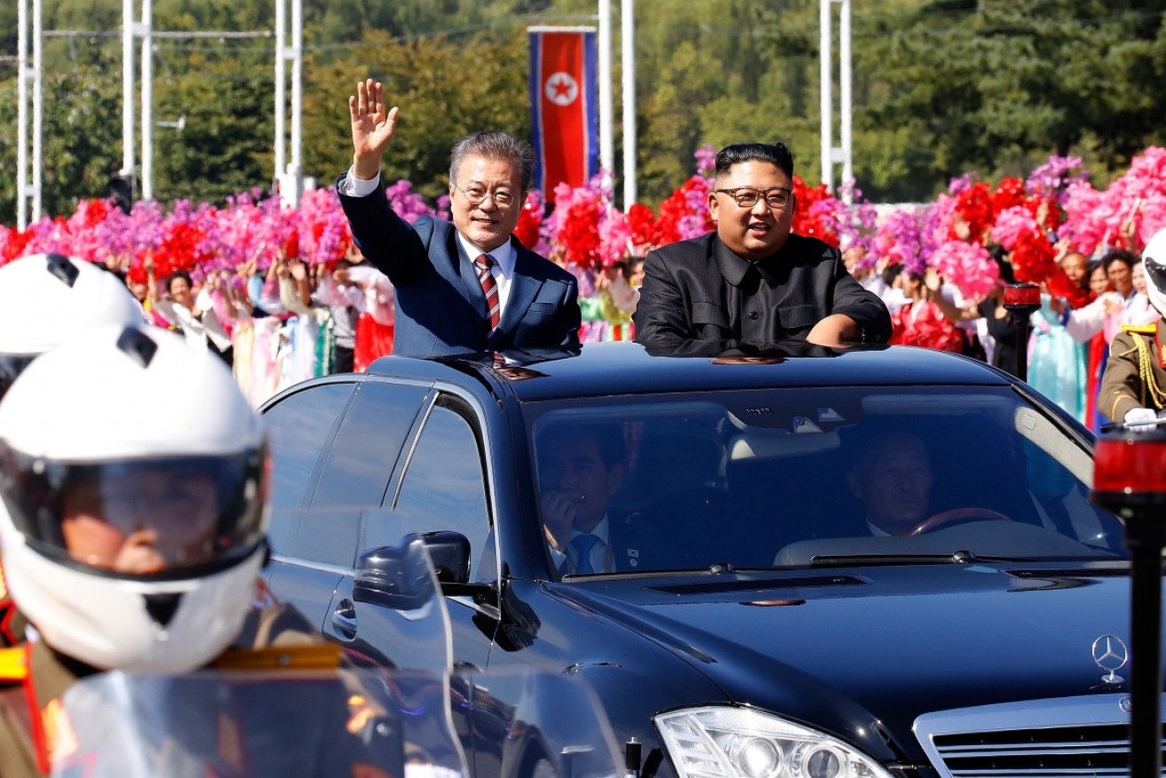 South Korean President Moon Jae-in and North Korean leader Kim Jong-un greet crowds on Tuesday in Pyongyang.