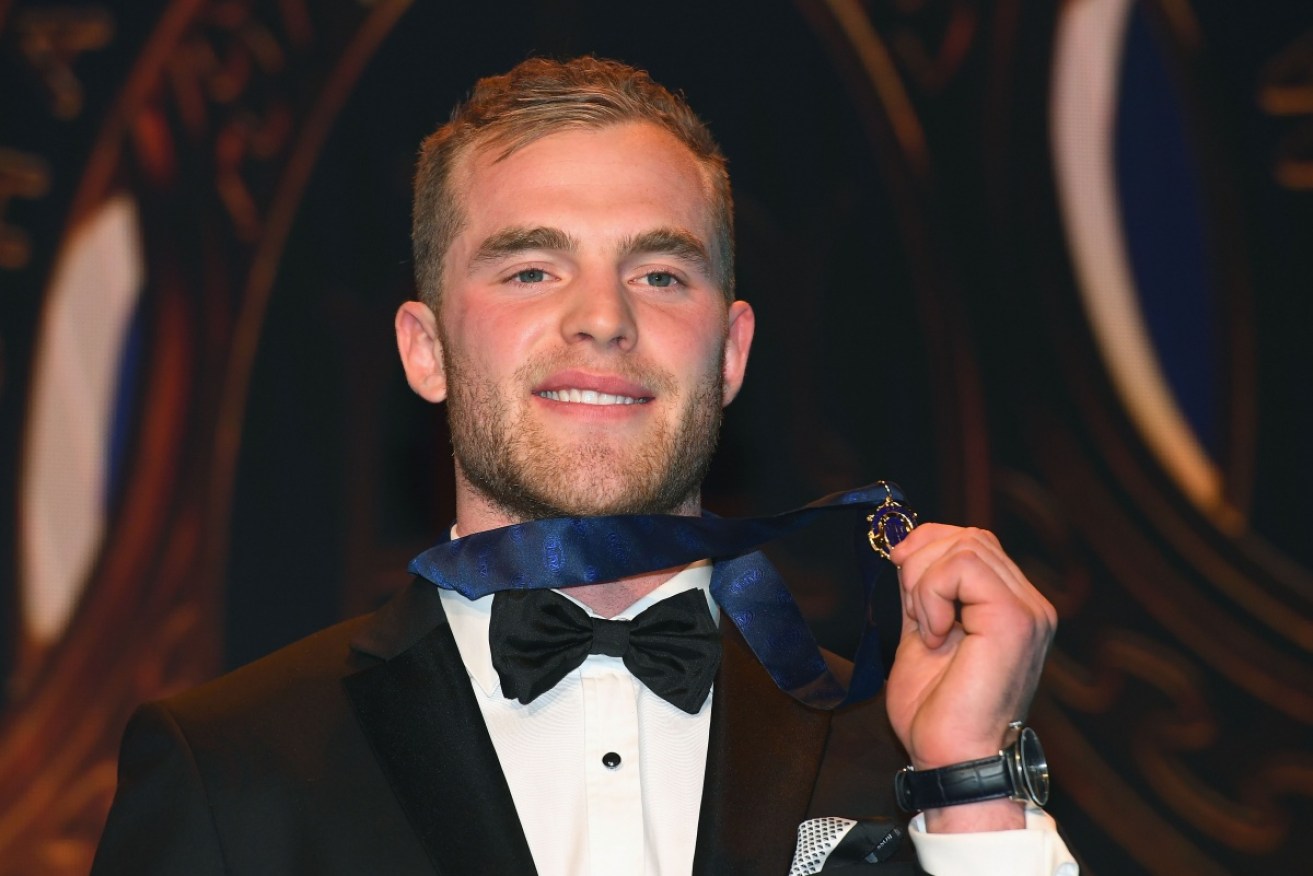 Hawthorn's Tom Mitchell celebrates after winning the Brownlow for his 2018 season. 