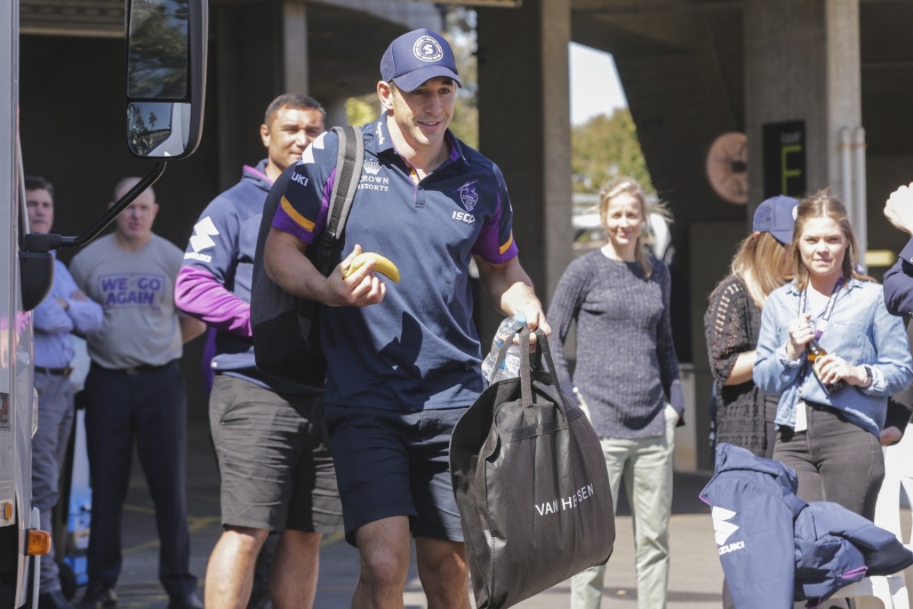 Billy Slater boards the Melbourne Storm team bus as he prepares to head back to Sydney.