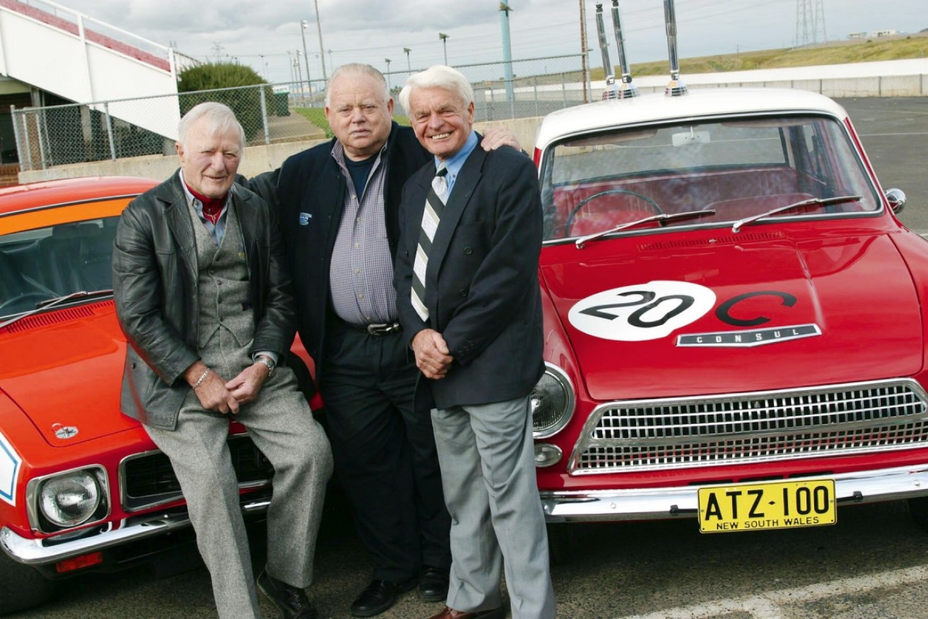 Jane celebrates the launch of the Bob Jane T-Marts 1000 with co-drivers Harry Firth and George Reynolds.  