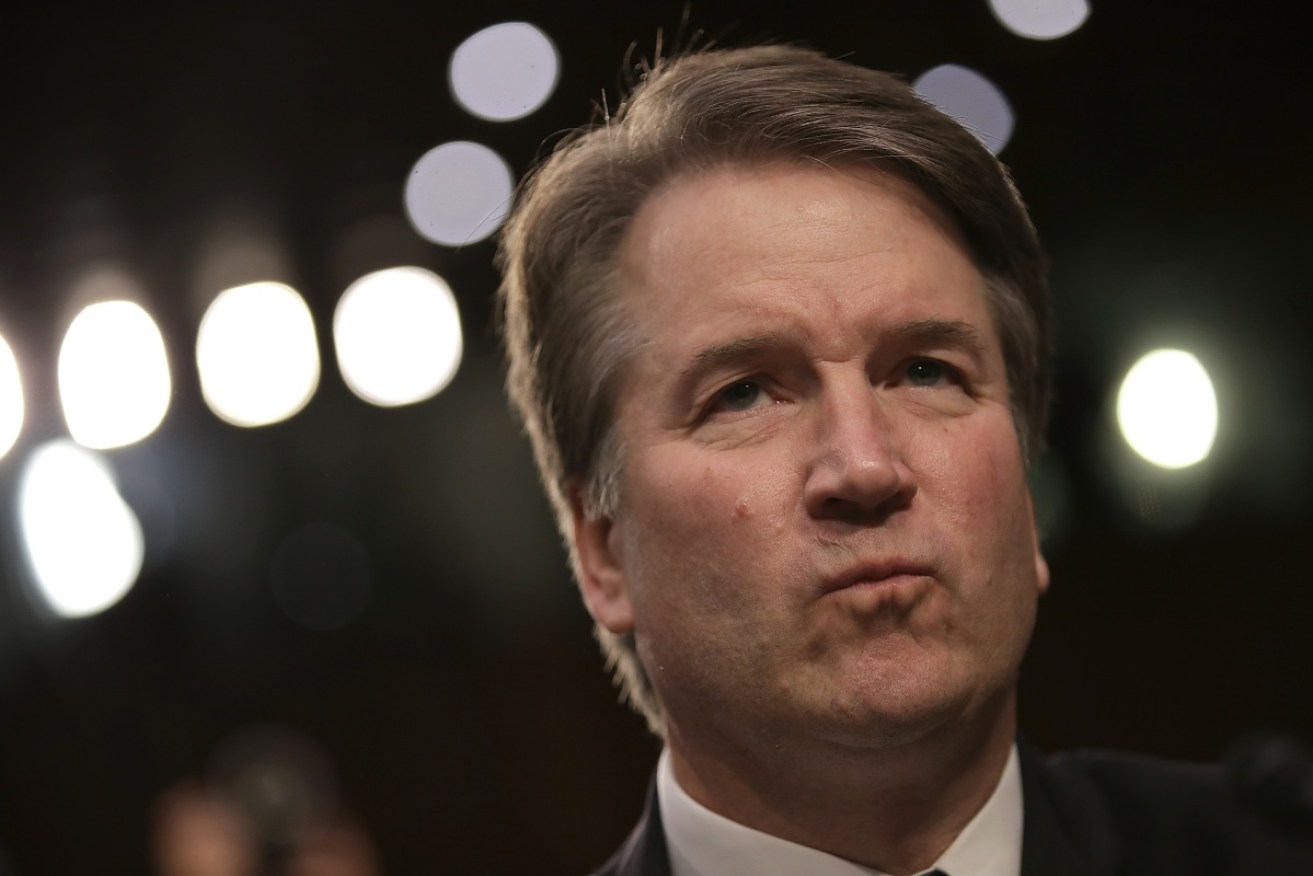 An armed man was arrested close to the home of US Supreme Court Justice Brett Kavanaugh, police say.