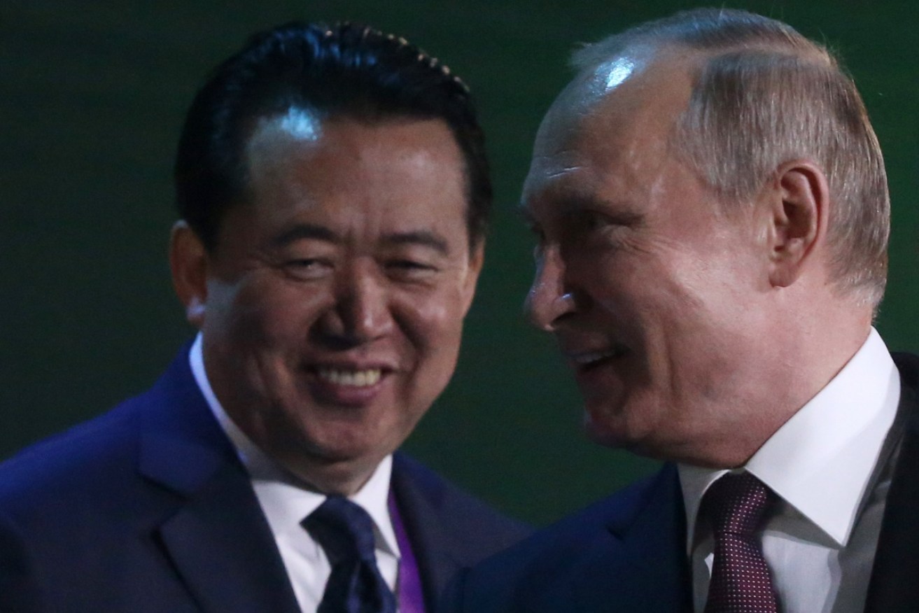 Former Interpol director Meng Hongwei with Russian President Vladimir Putin in Moscow in July. 