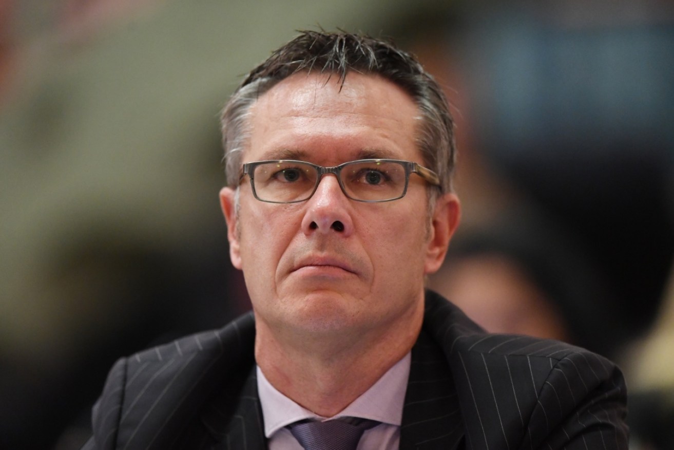 Reserve Bank deputy governor Guy Debelle looks on at the NSW State Parliament.