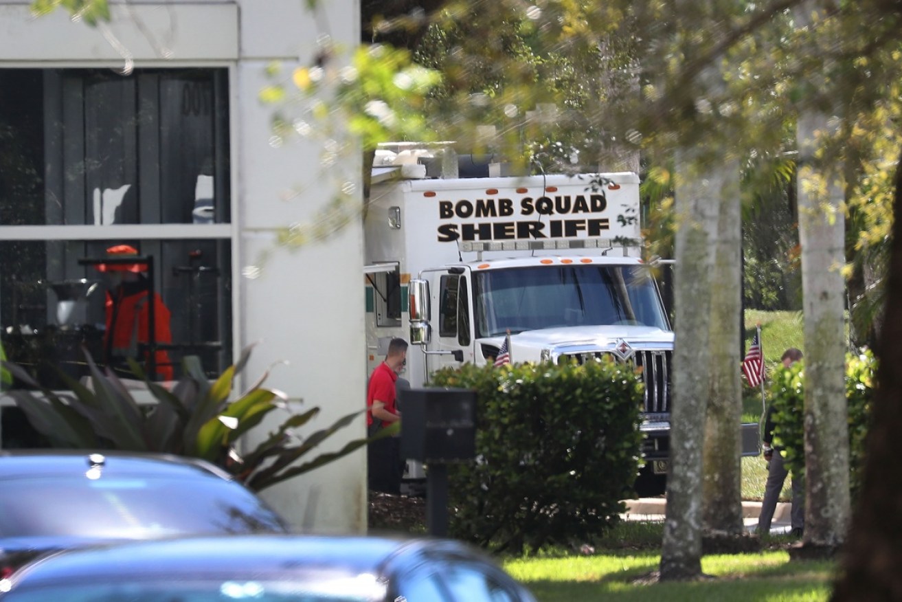 Florida's Broward Sheriff's Office bomb squad investigates a suspicious package at the office of Democrat Debbie Wasserman Schultz.  