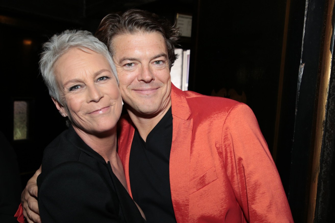 Jamie Lee Curtis with Jason Blum on the black carpet at the Los Angeles premiere of <i>Halloween</i> on October 19.