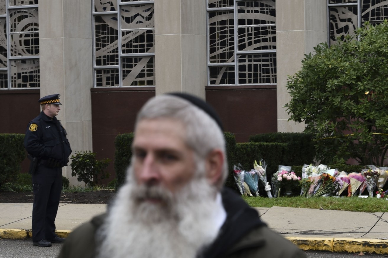 A man suspected of bursting into a Pittsburgh synagogue during a baby-naming ceremony and gunning down 11 people has been charged with murder,