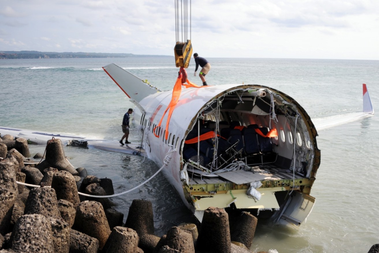 Lion Air's deadly Boeing 737 being removed from the sea four days after it crashed in 2013. 