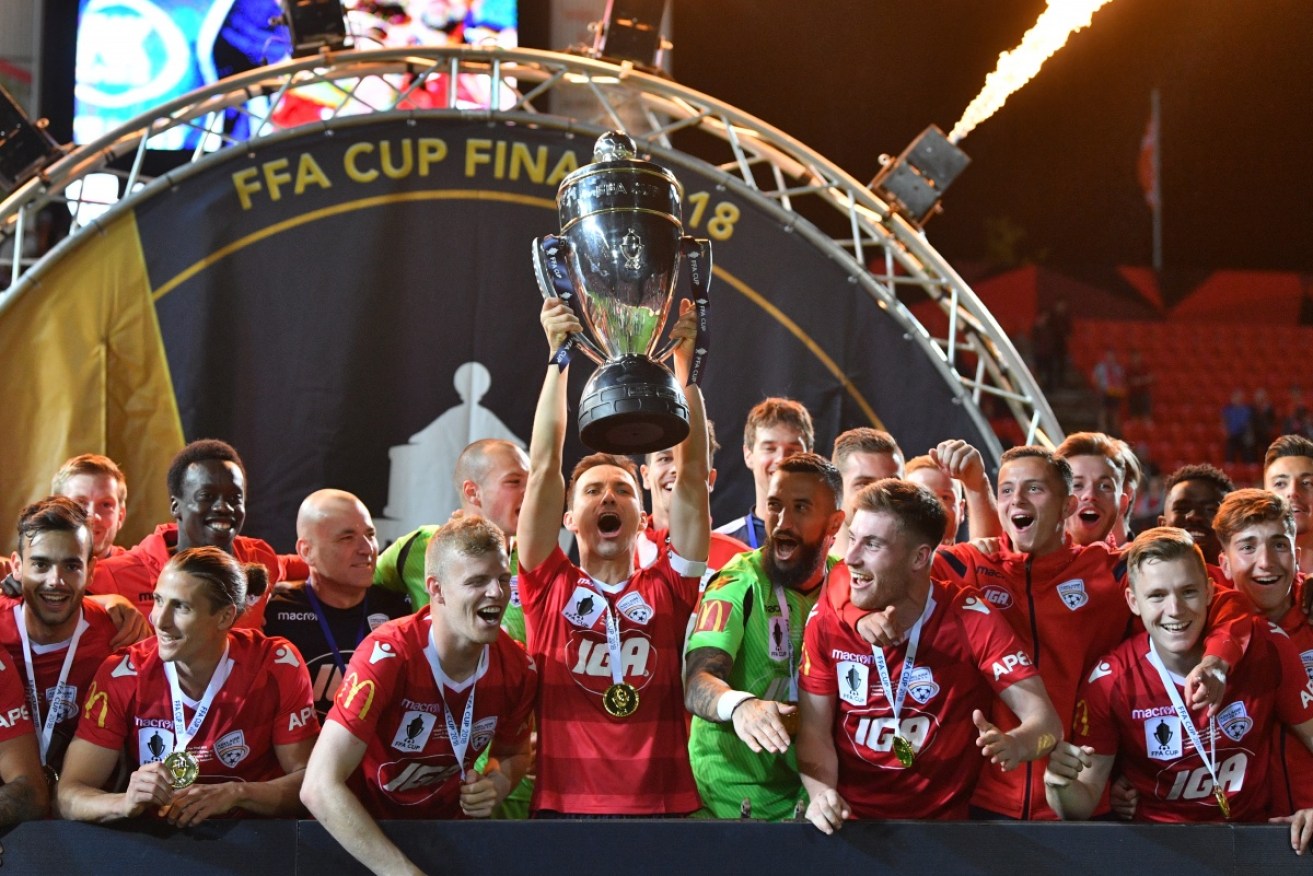Adelaide United celebrate their FFA Cup victory.