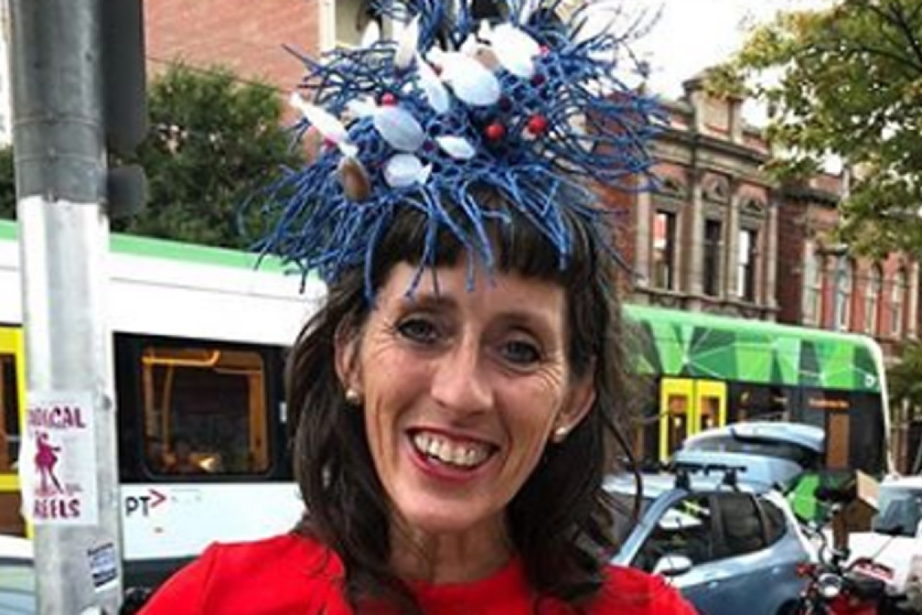 Carolyn Cardinet in her alternative Melbourne Cup look (if the day is cold), with fascinator made from soy sauce fish bottles.