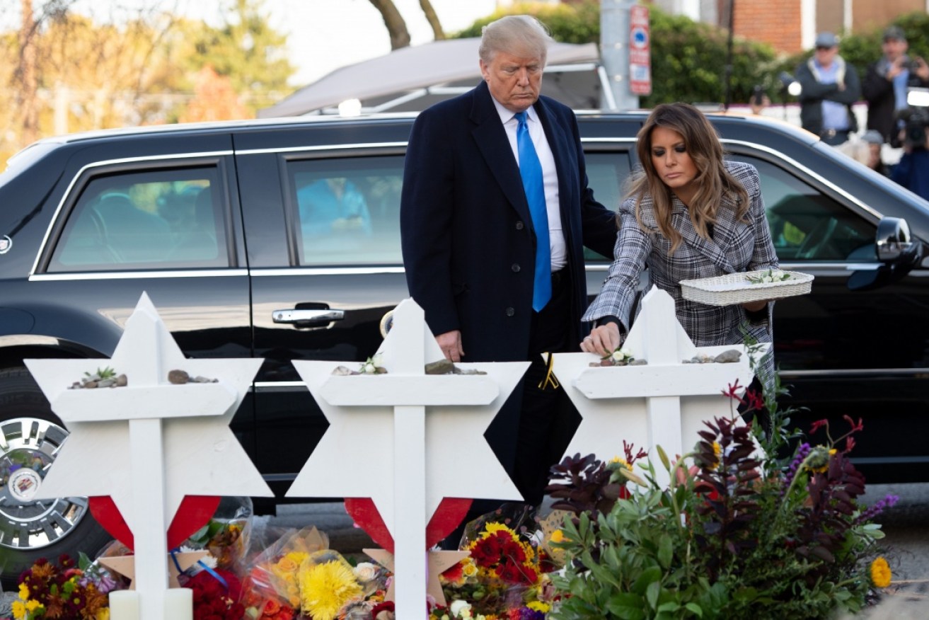 Donald Trump paying tribute to those slain at the Tree of Life synagogue in Pittsburgh in November. Photo: Getty