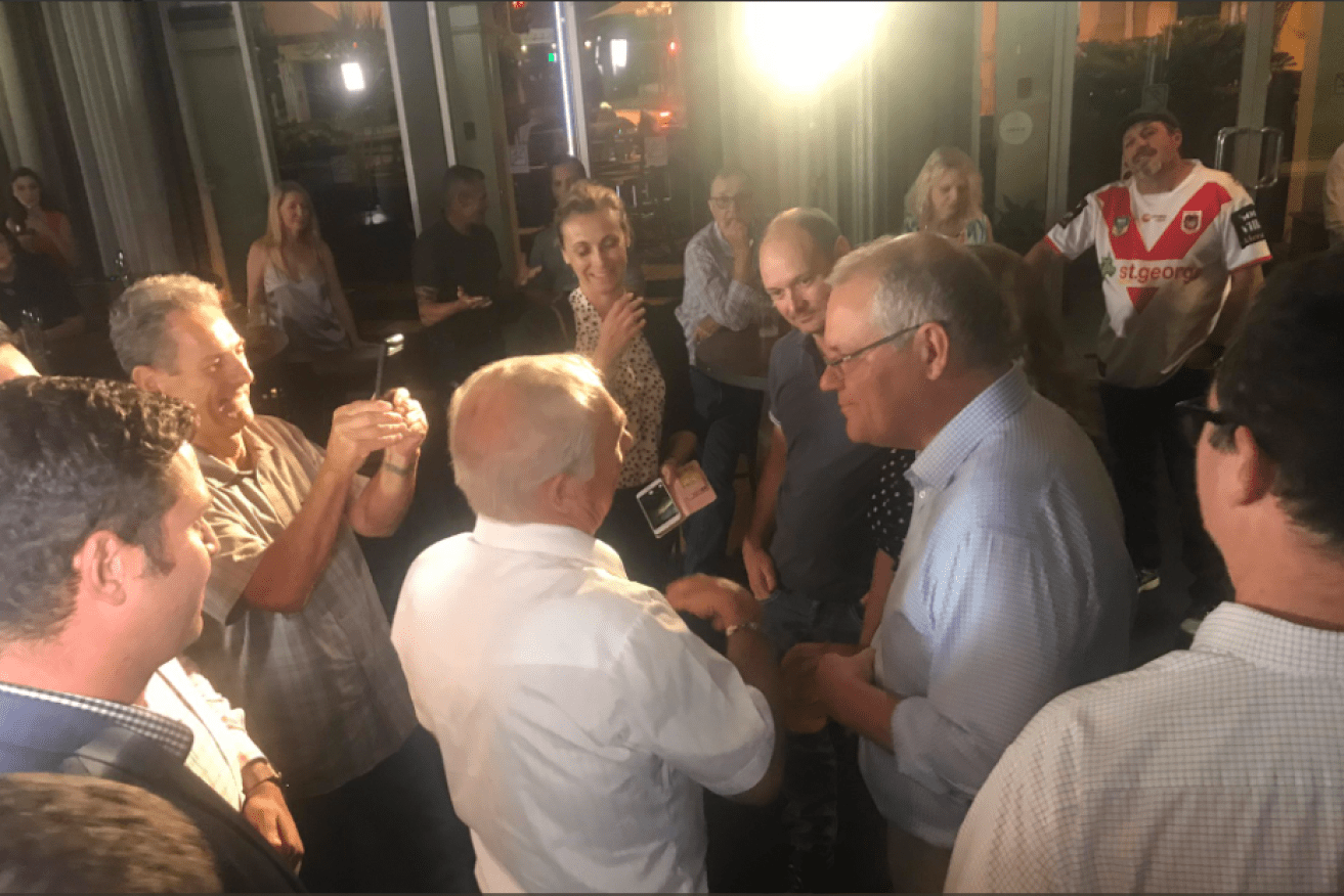 The PM presses the flesh with locals in Townsville on Wednesday night.