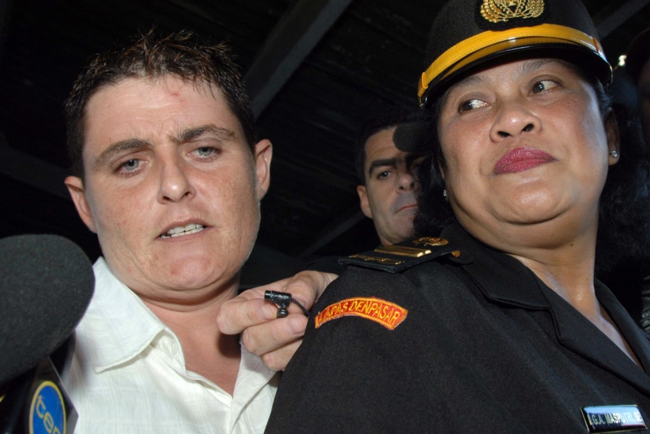 Renae Lawrence with a Kerobokan prison guard in 2010. She is to be released from jail on November 21.