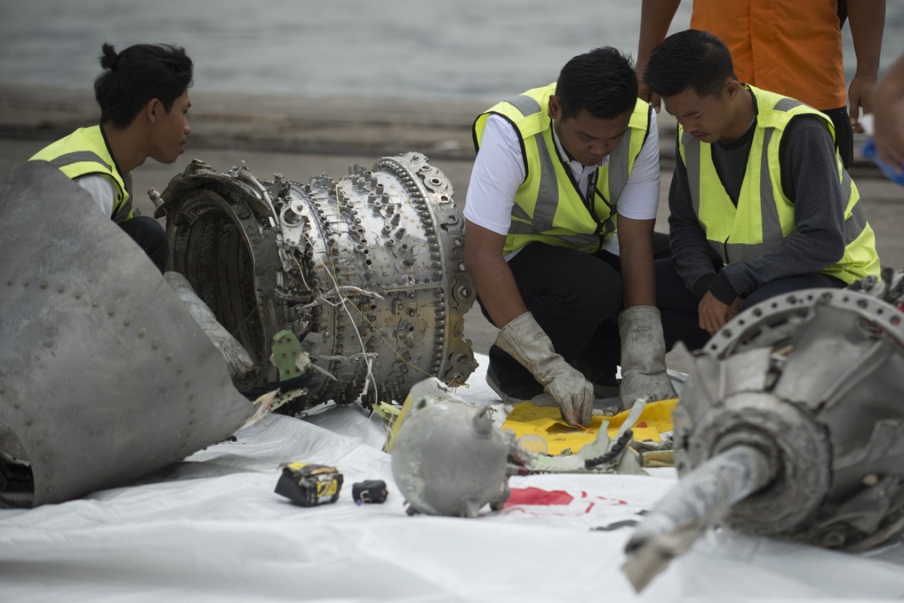 Investigators examine engine parts from Lion Air's doomed Boeing Max.
