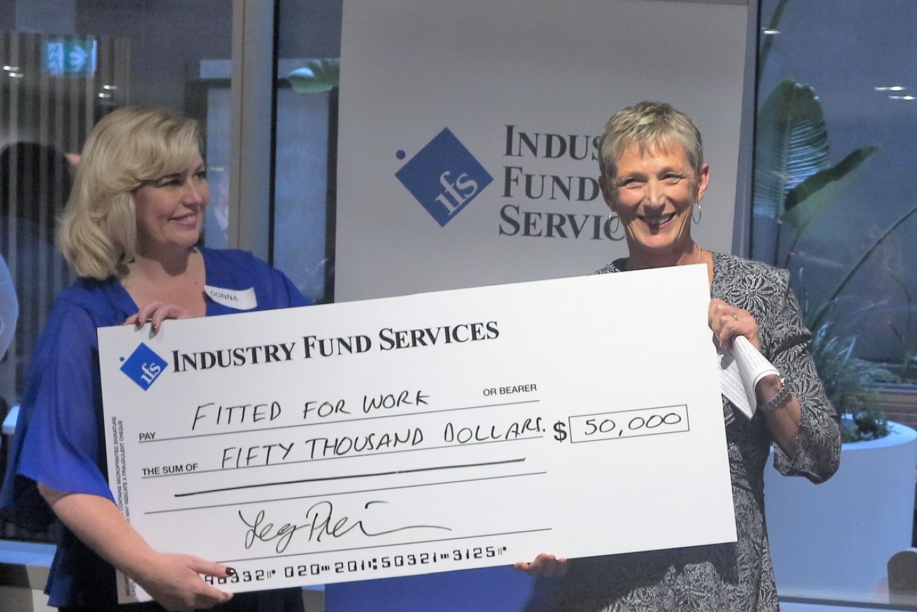 Cath Bowtell (right) presenting the cheque to Donna de Zwart, Chief Executive Officer from Fitted for Work (left).