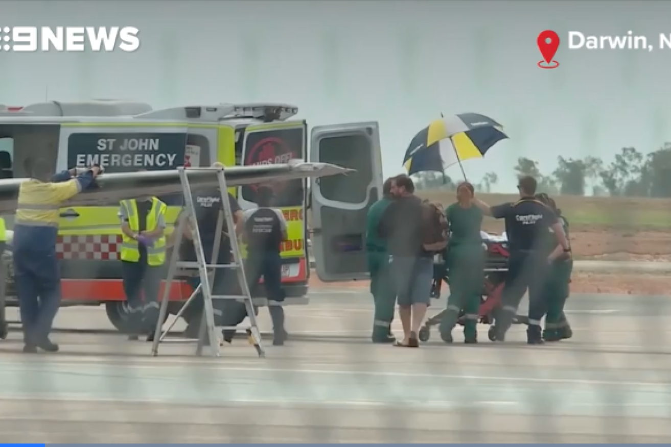 The teen is transported to hospital after landing in Darwin on Sunday.  