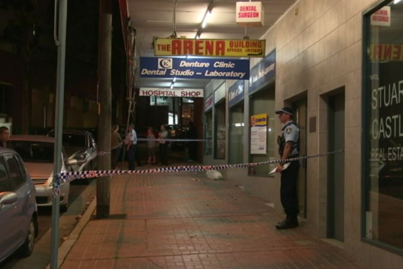 A police officer guards the scene of a dance studio in Kogarah, where the alleged assault occurred.