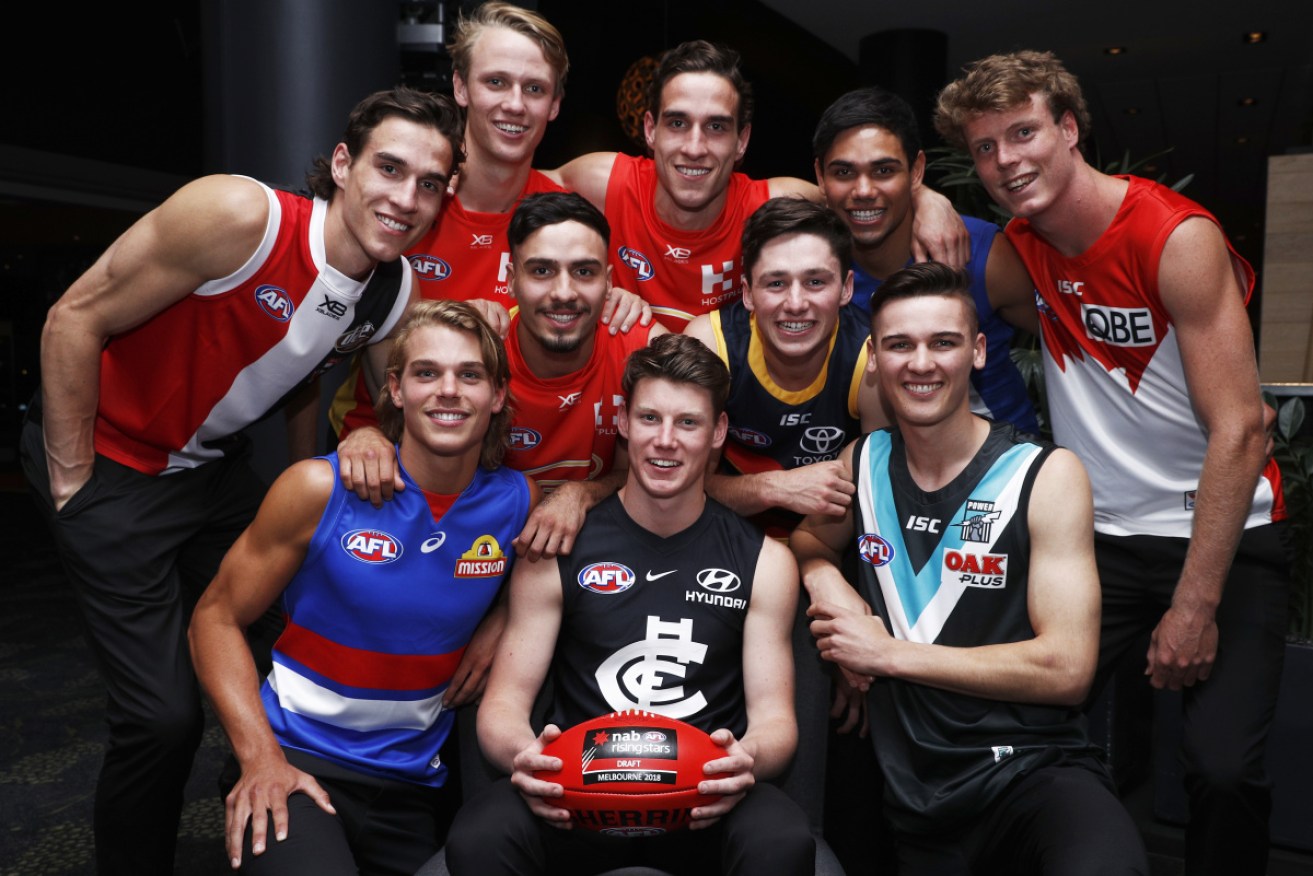 The top 10 picks pose at the 2018 AFL Draft. Photo: AAP