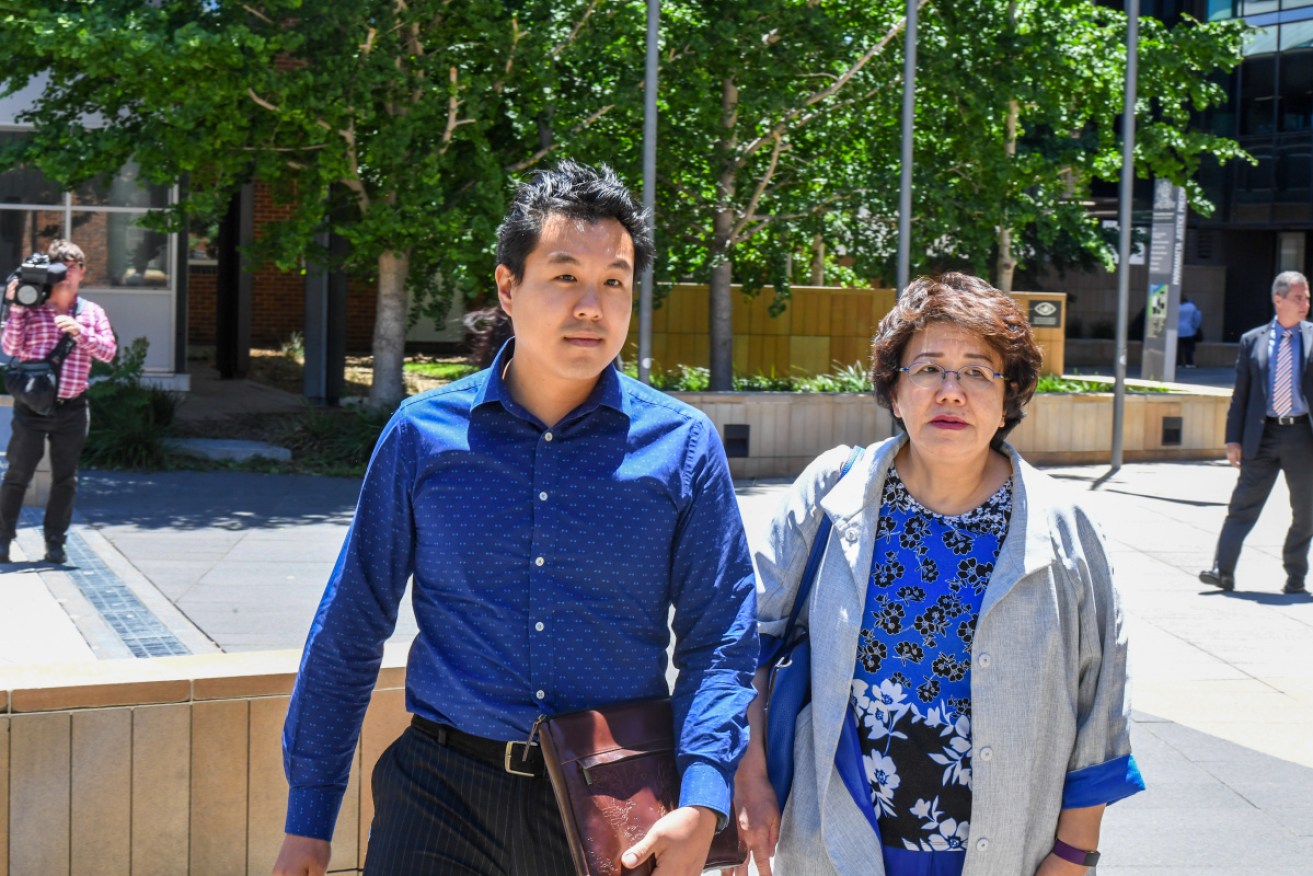 Curtis Cheng's widow Selina Cheng and their son Alpha leave the NSW Supreme Court after the sentence was handed down.